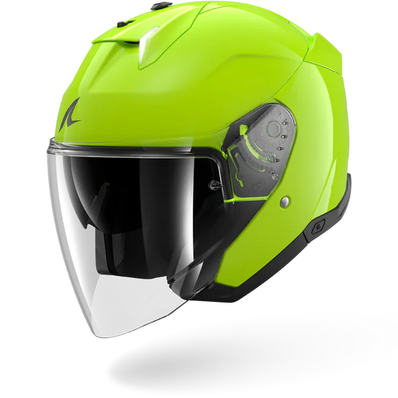 Green motorcycle helmet with a clear visor on a white background