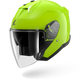 Green motorcycle helmet with a clear visor on a white background