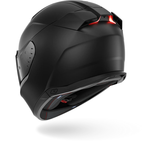 Black motorcycle helmet with red light on a white background