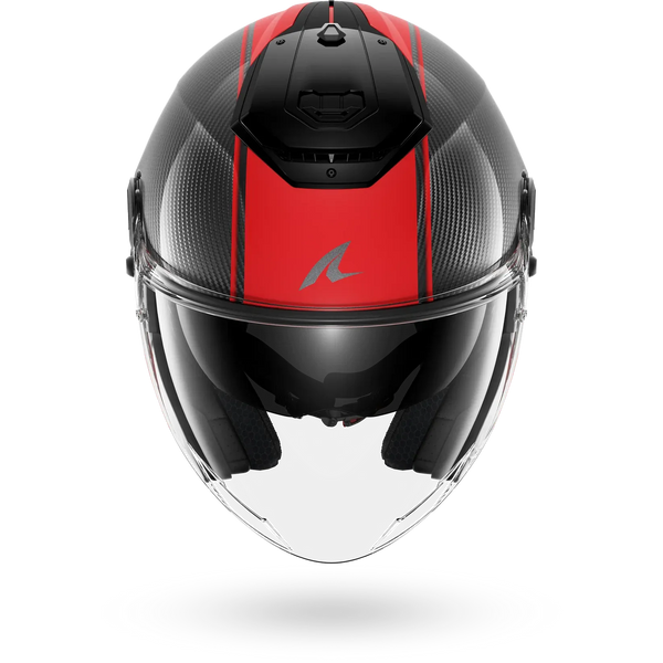 A carbon fiber full-face motorcycle helmet with a vibrant red stripe down the center, a silver stylized 'Shark' logo on the forehead, and a clear visor, shown against a plain white background.