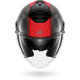 A carbon fiber full-face motorcycle helmet with a vibrant red stripe down the center, a silver stylized 'Shark' logo on the forehead, and a clear visor, shown against a plain white background.